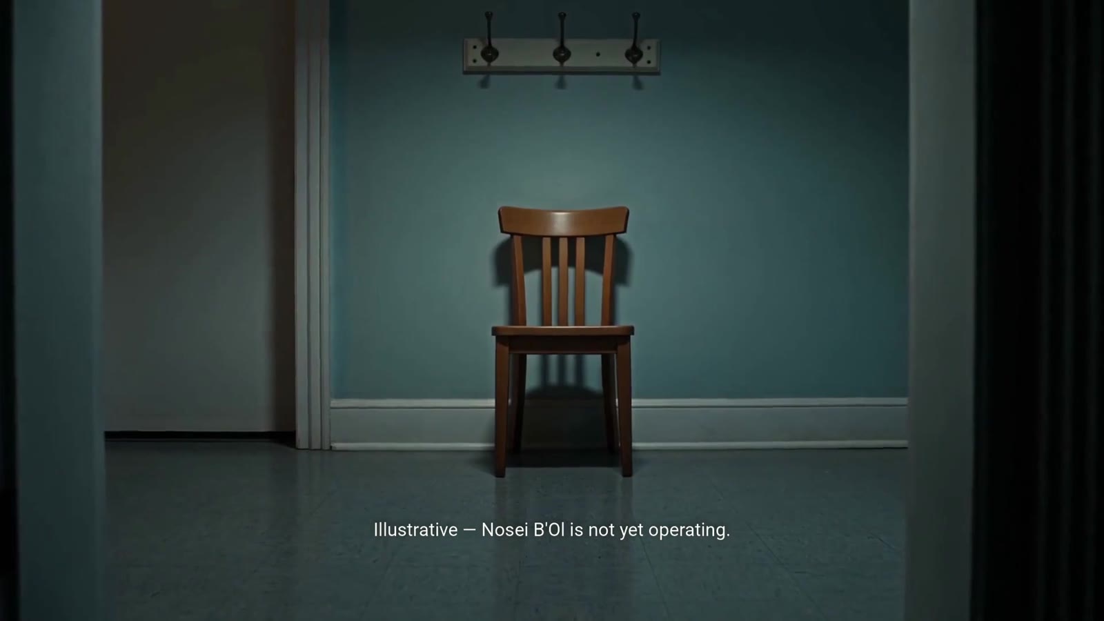 A single empty wooden chair against a pale green classroom wall