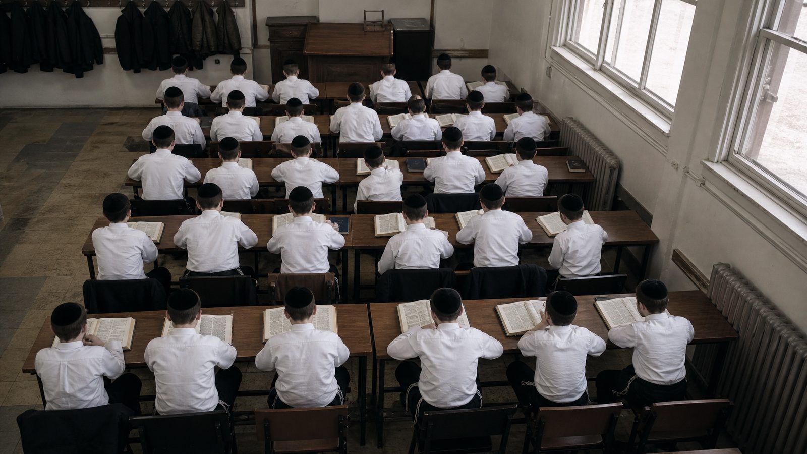 A full yeshiva classroom seen from above and behind